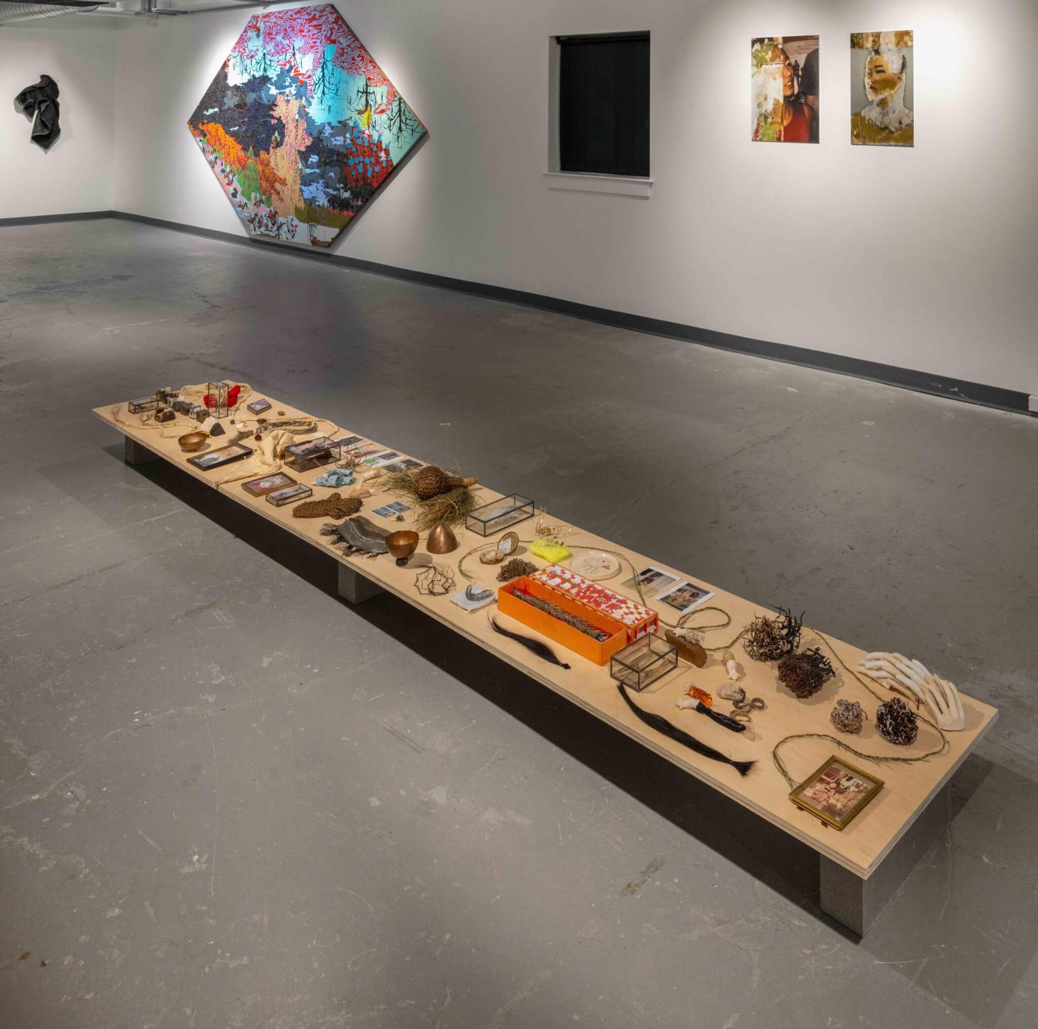 A low dining table displaying various objects.